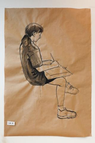 Illustration: Mädchen sitzt und zeichnet